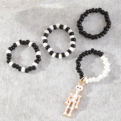 Anillos midi de calavera con cuentas blancas y negras para Halloween para mujer