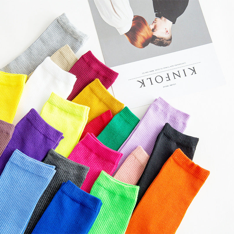 Calcetines de tubo de color liso sencillos a la moda para mujer