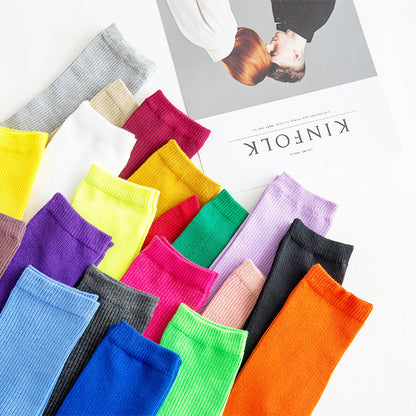 Calcetines de tubo de color liso sencillos a la moda para mujer