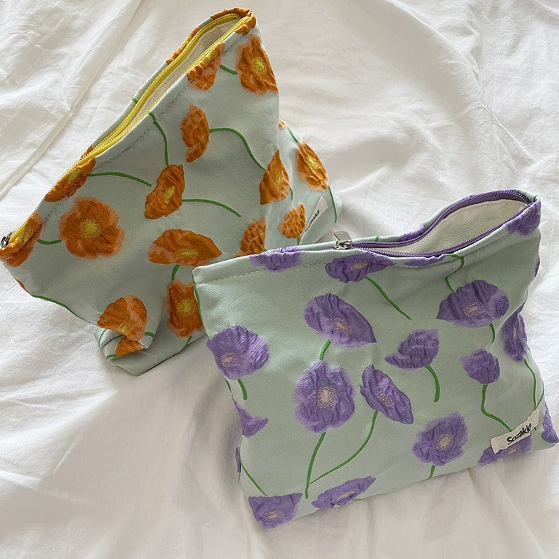 Elegante neceser con estampado de flores y cremallera