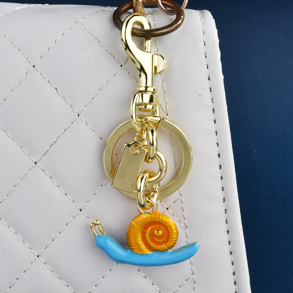 Llavero con colgante de bolso de caracol de moda, aleación orgánica marina, accesorios de moda