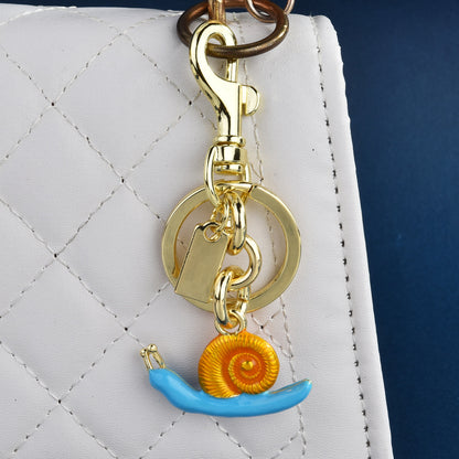 Llavero con colgante de bolso de caracol de moda, aleación orgánica marina, accesorios de moda