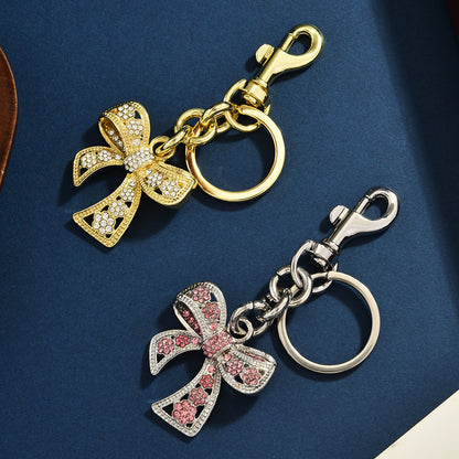 Llavero con colgante de bolso con lazo de diamantes de imitación creativo para mujer
