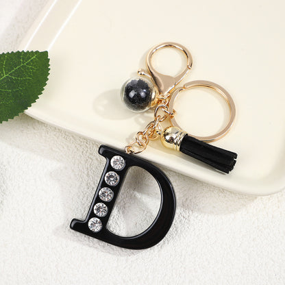 Llavero de resina negra con letras de diamantes de imitación, accesorio de arte moderno