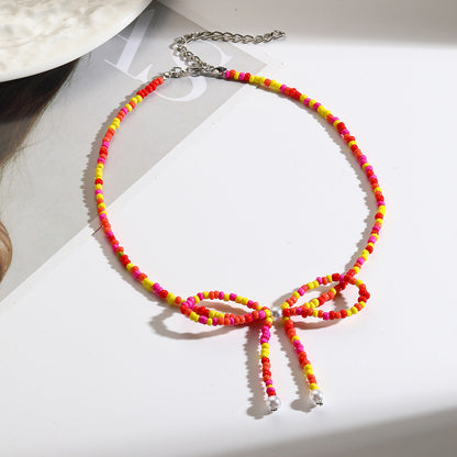 Collar bohemio con cuentas de arroz y lazo para mujer