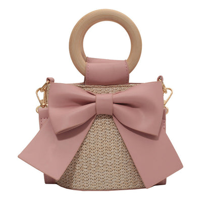 Bolso tipo cubo de paja tejida con lazo de estilo bohemio