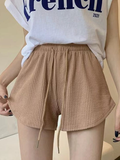 Pantalones cortos holgados de cintura alta con diseño de gofre de color liso a la moda para mujer
