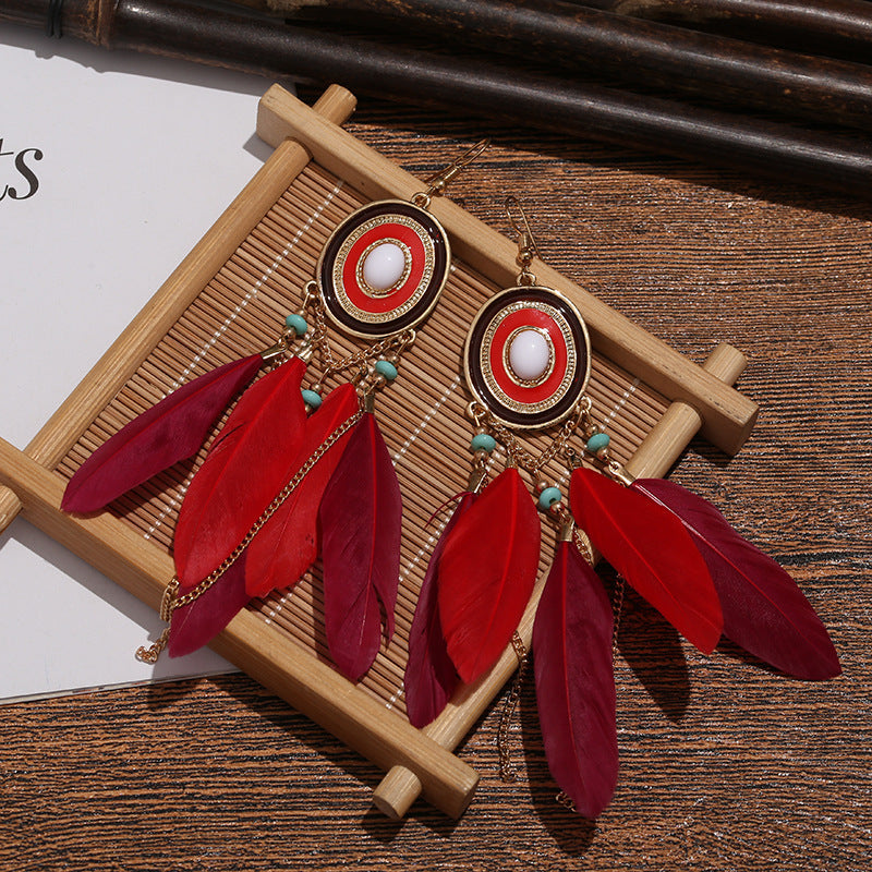 Pendientes bohemios con borlas de plumas exageradas