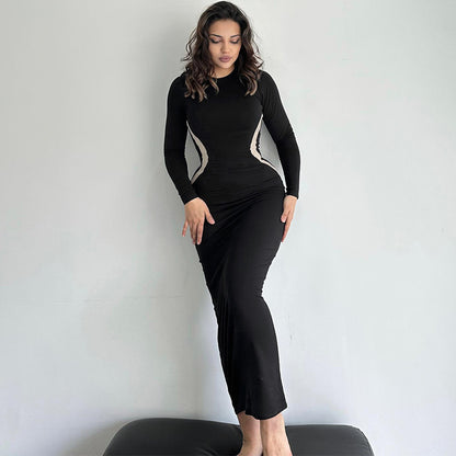 Vestido largo de manga larga con cuello redondo y cintura definida para mujer