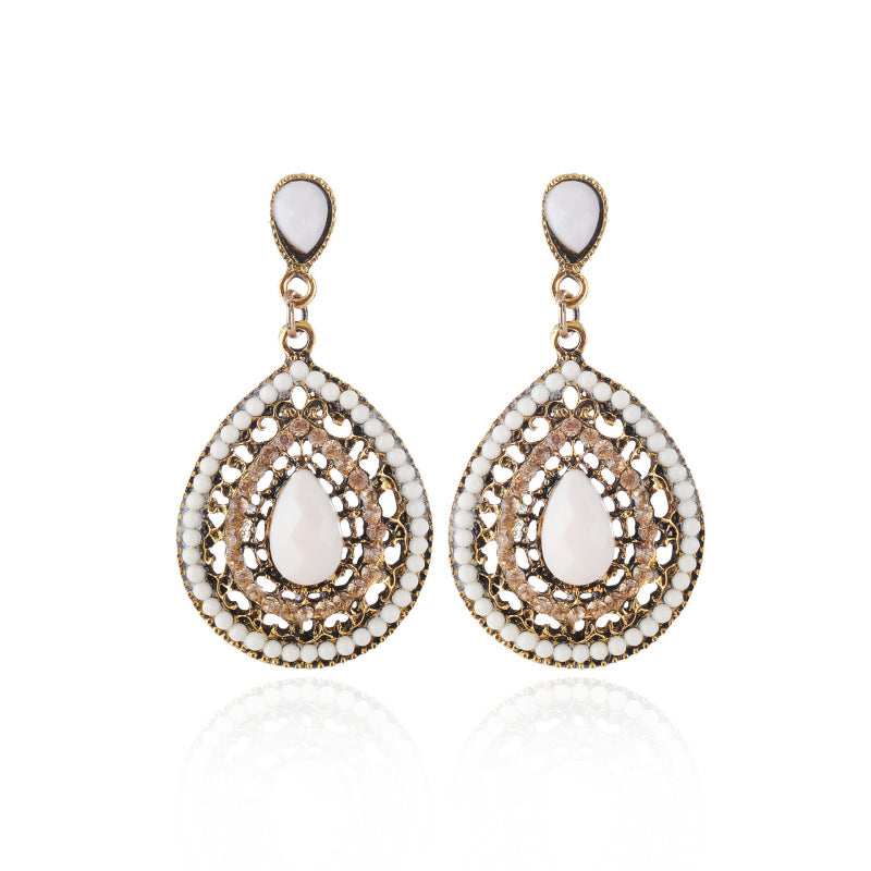 Pendientes colgantes con piedras preciosas huecas de estilo bohemio para mujer