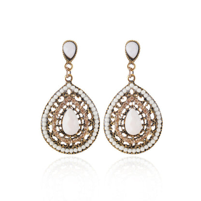 Pendientes colgantes con piedras preciosas huecas de estilo bohemio para mujer