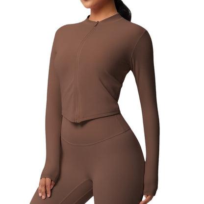 Top deportivo de manga larga de color liso a la moda para mujer