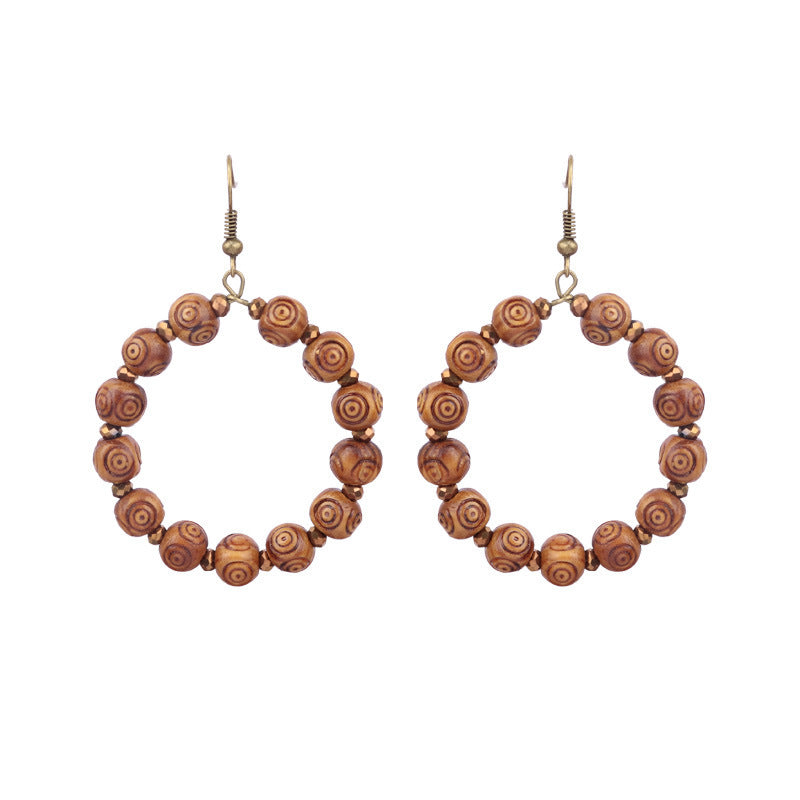 Pendientes de borlas hechos a mano con cuentas de madera bohemias