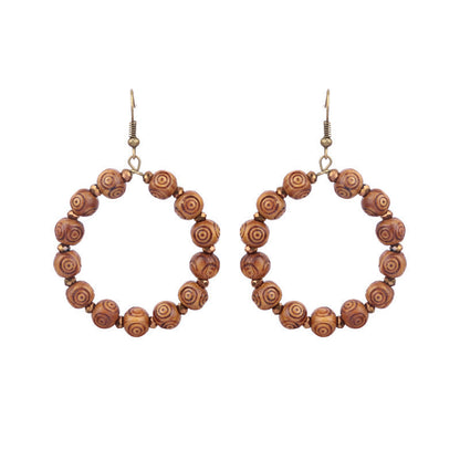 Pendientes de borlas hechos a mano con cuentas de madera bohemias