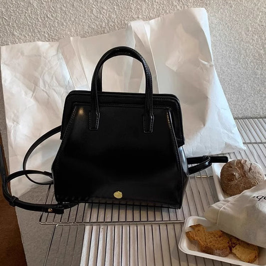 Bolso de mano retro informal de piel encerada negra para mujer